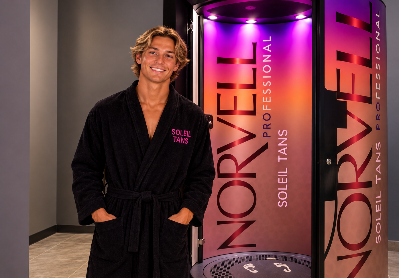 Spray Guest in a Soleil Tans robe beside the Norvell Auto Revolution booth